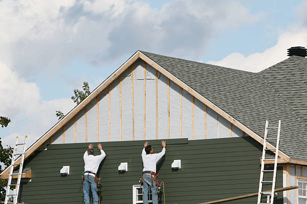 Professional Siding technician working in Quincy, MA